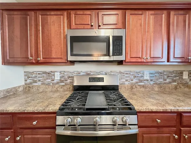 a view of living room with furniture and a flat screen tv
