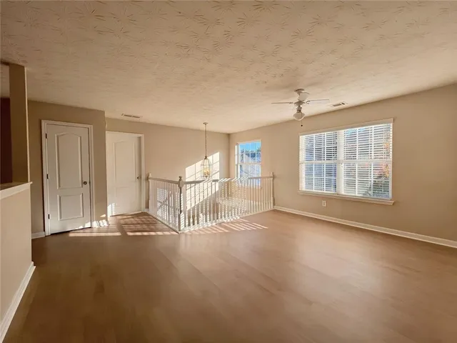 a bathroom with a double vanity sink mirror and shower