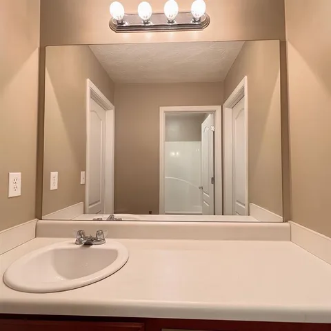 a view of yard with swimming pool and seating area