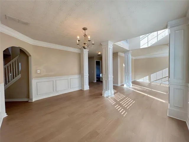 a view of an empty room and glass door