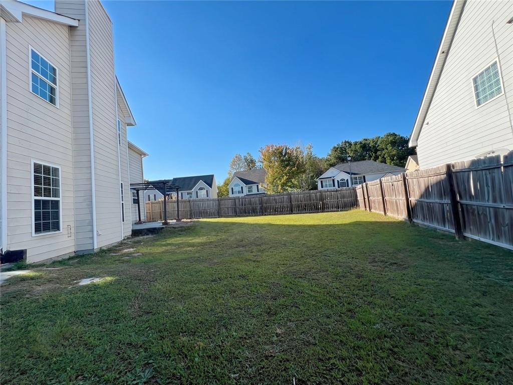 2751 Spence Court Northeast Dacula, GA 30019 - Photo 60 of 60 a view of yard with swimming pool and seating area