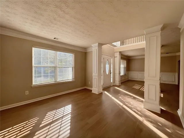 a view of a room with a ceiling fan