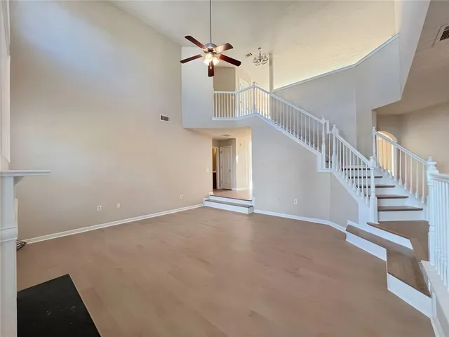 a large kitchen with a large counter top appliances and cabinets