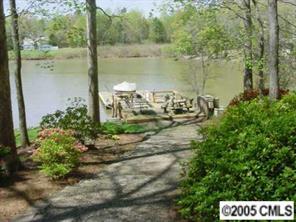 12 Pine Point Road Lake Wylie, SC 29710 - Photo 2 of 8 a view of a lake with a big yard