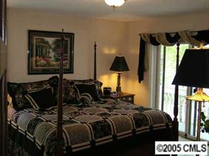 12 Pine Point Road Lake Wylie, SC 29710 - Photo 6 of 8 a bedroom with a bed and walk in closet