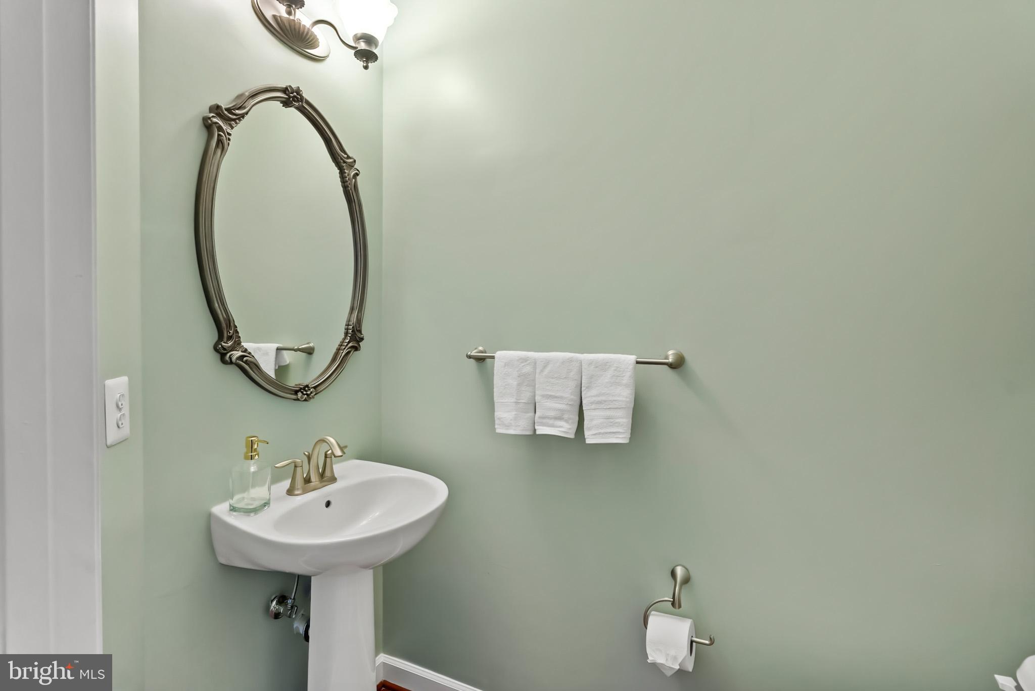 904 West Glebe Road Alexandria, VA 22305 - Photo 26 of 38 a bathroom with a sink and a mirror