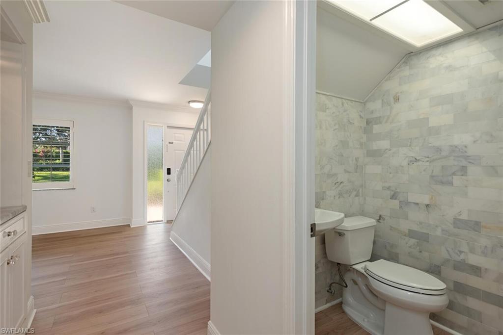 185 4th Street South Naples, FL 34102 - Photo 12 of 22 a bathroom with a toilet and a shower