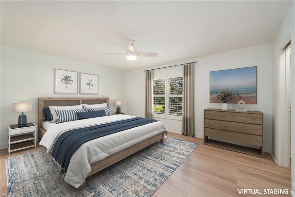 185 4th Street South Naples, FL 34102 - Photo 13 of 22 a bedroom with a bed and a dresser