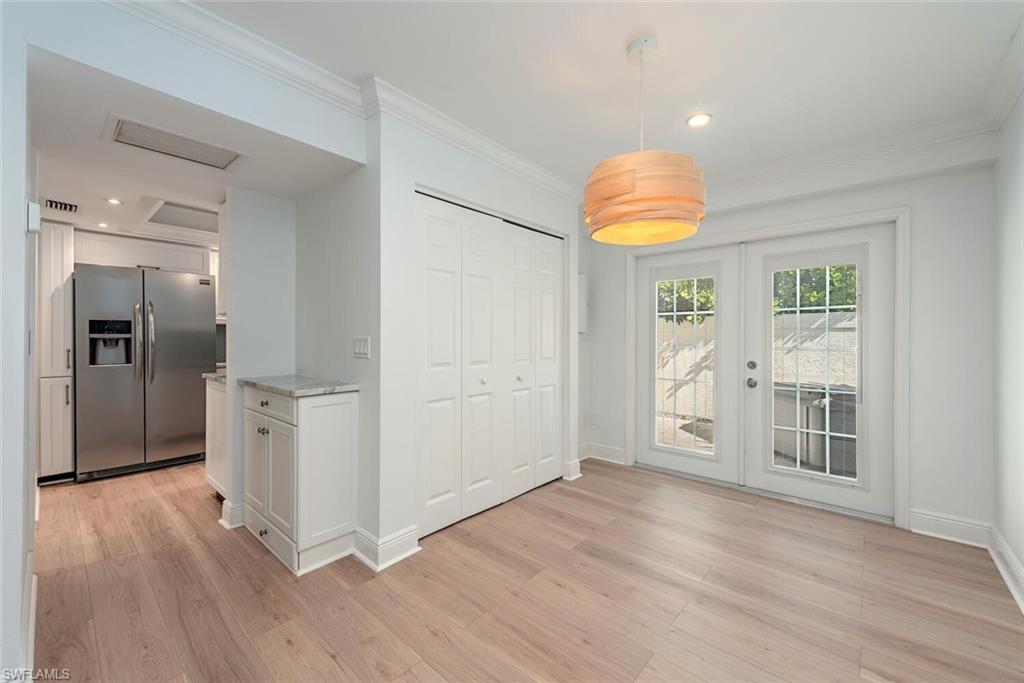 185 4th Street South Naples, FL 34102 - Photo 19 of 22 a view of empty room with wooden floor and fan