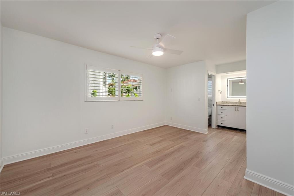 185 4th Street South Naples, FL 34102 - Photo 21 of 22 an empty room with windows and cabinet