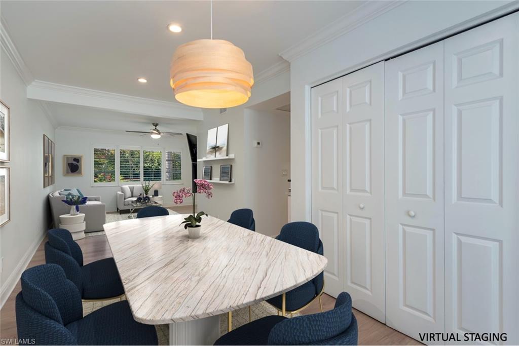 185 4th Street South Naples, FL 34102 - Photo 9 of 22 a dining room with furniture and window