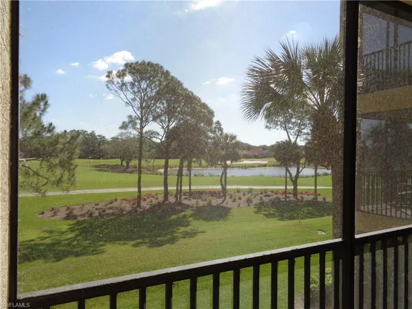 a view of a yard with a lake view
