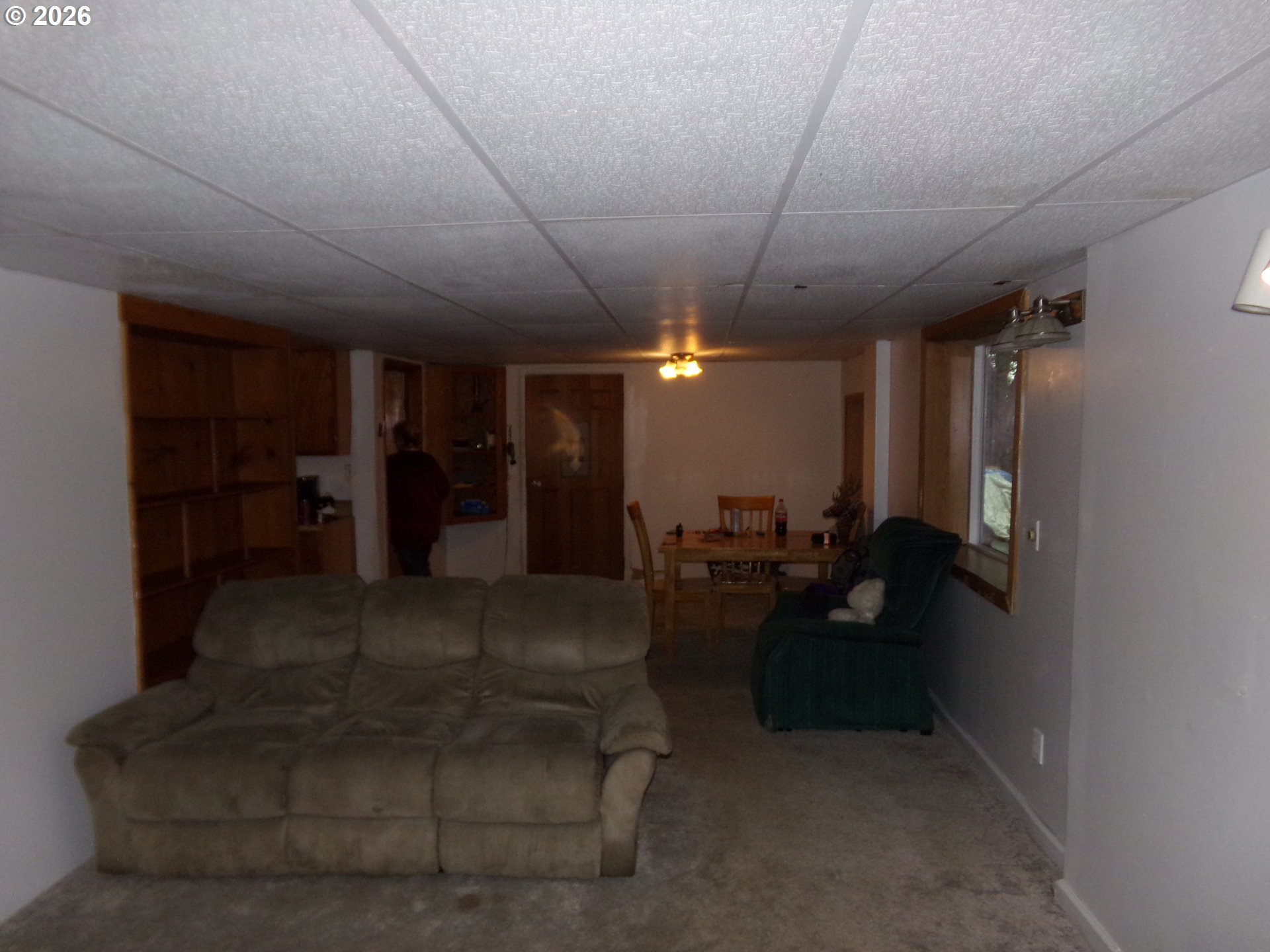 32211 Southeast Proctor Street Gresham, OR 97080 - Photo 12 of 27 a living room with furniture and a chandelier