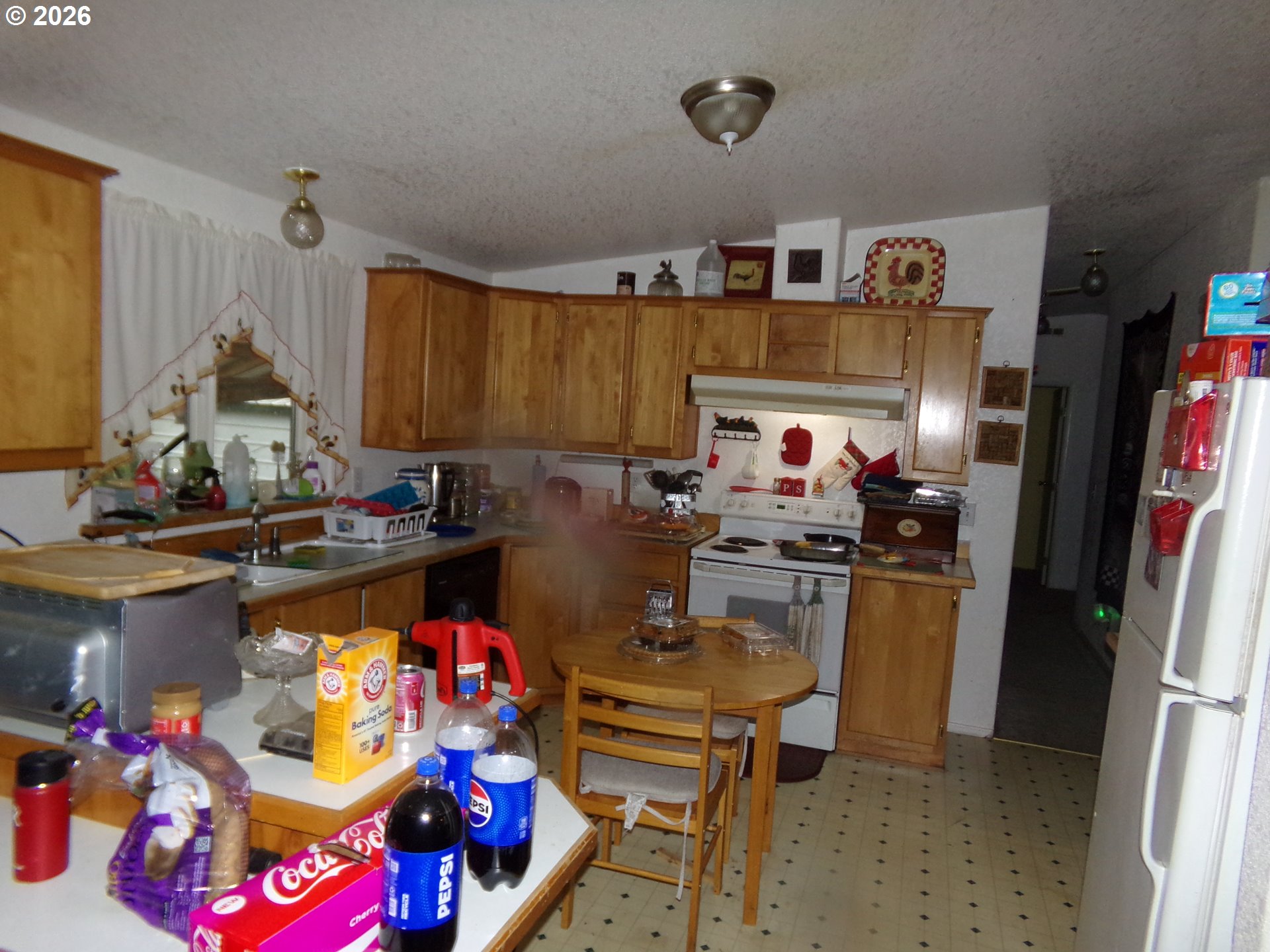 32211 Southeast Proctor Street Gresham, OR 97080 - Photo 18 of 27 a kitchen with refrigerator and stove