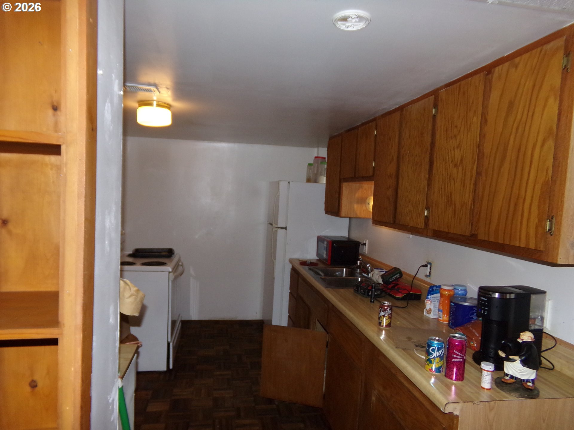 32211 Southeast Proctor Street Gresham, OR 97080 - Photo 9 of 27 a kitchen with a refrigerator and a stove top oven
