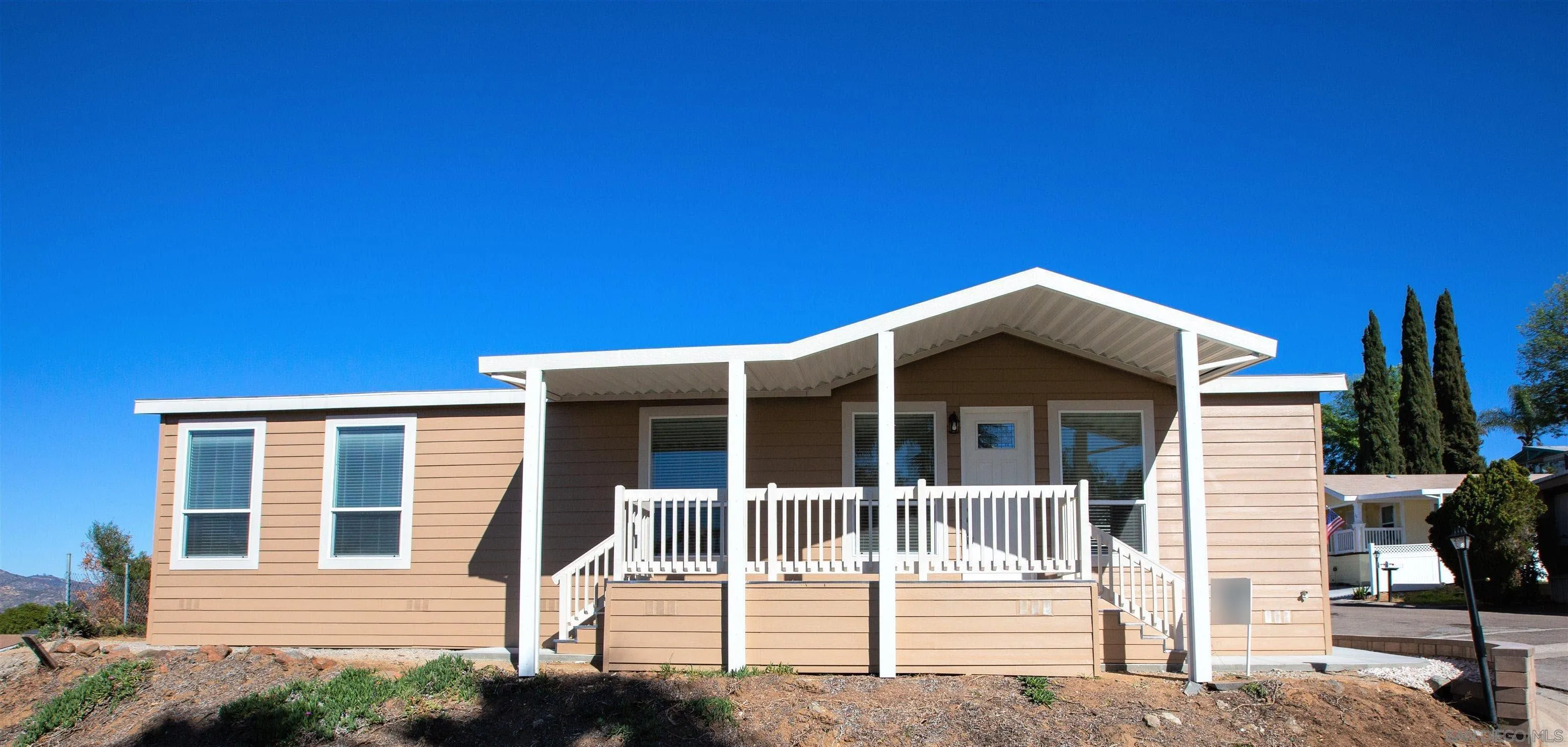 a front view of a house with a porch