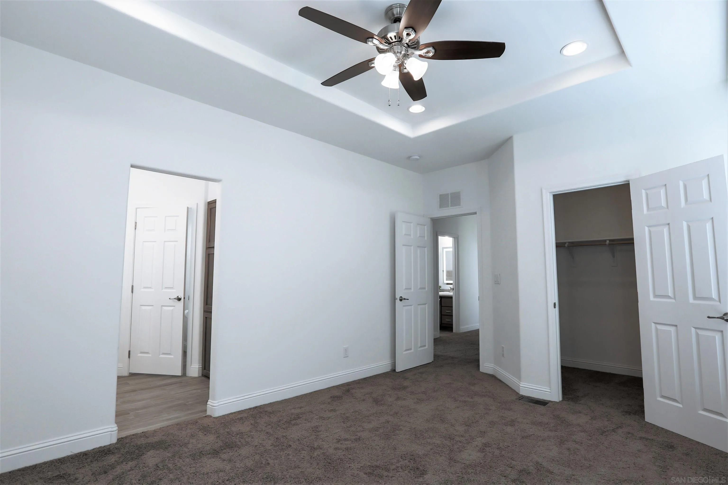 13217 Aurora Drive, Unit 32 El Cajon, CA 92021 - Photo 12 of 21 an empty room with closet and a ceiling fan