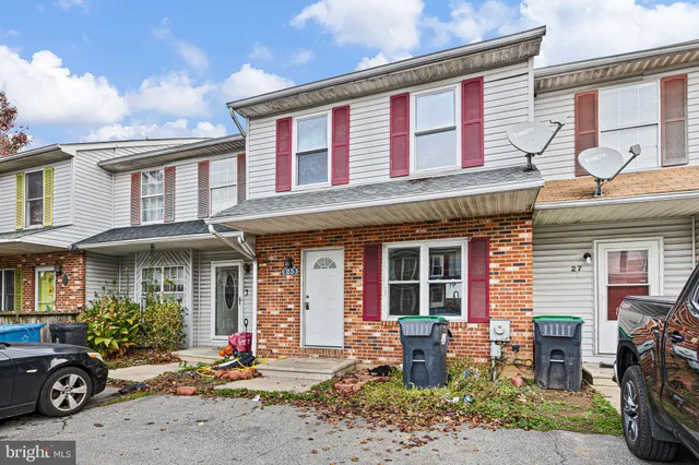 a front view of a building with seating space