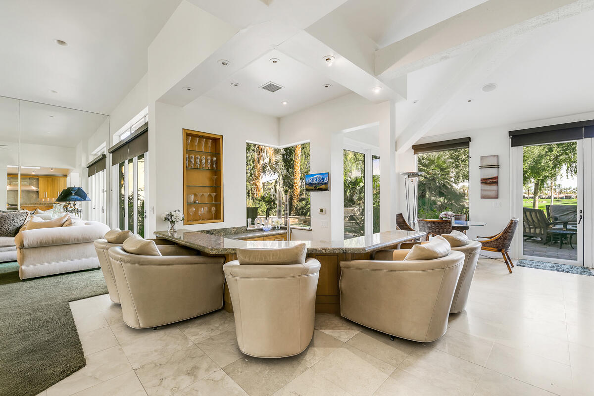 54310 Riviera La Quinta, CA 92253 - Photo 15 of 45 a living room with furniture and a large window