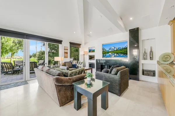 a living room with furniture and a large window