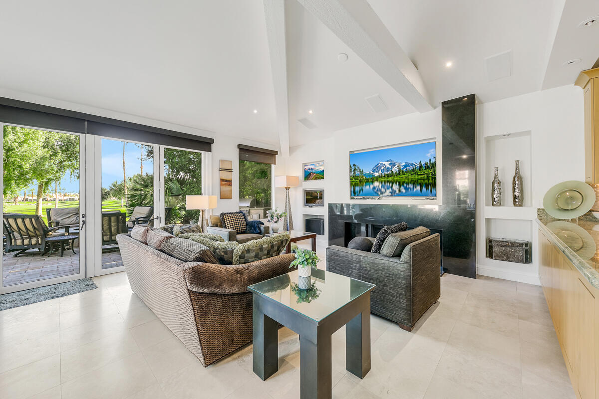 54310 Riviera La Quinta, CA 92253 - Photo 16 of 45 a living room with furniture and a large window