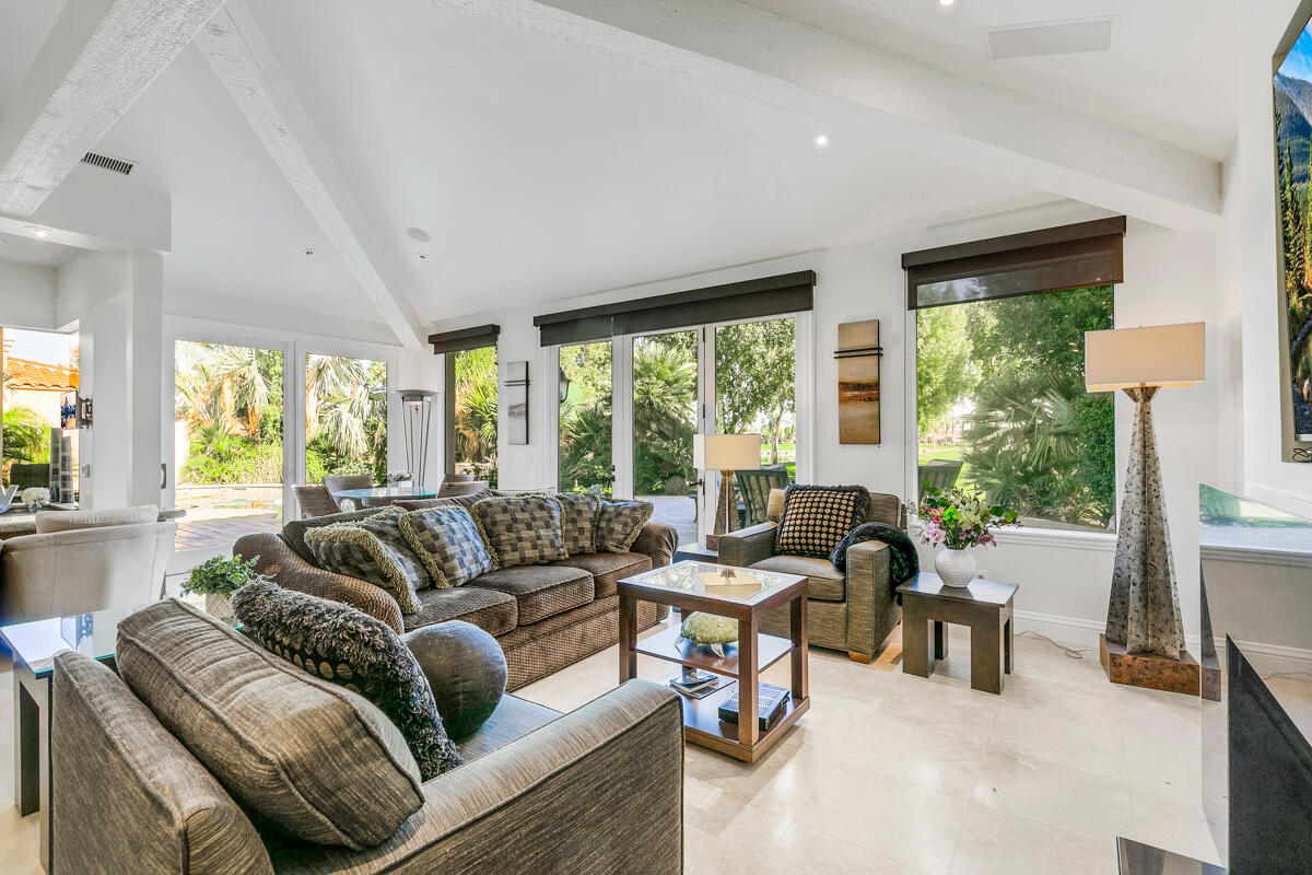 54310 Riviera La Quinta, CA 92253 - Photo 17 of 45 a living room with furniture and a large window