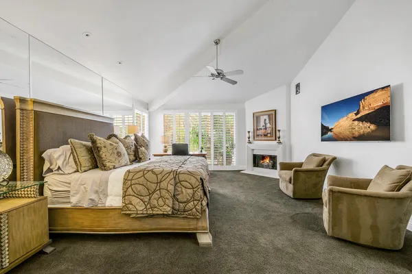 a bedroom with furniture and white walls