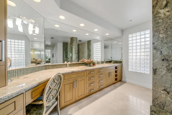 a large bathroom with a large tub and sink