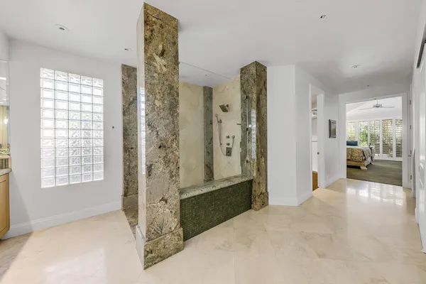 a room with a sink and a mirror