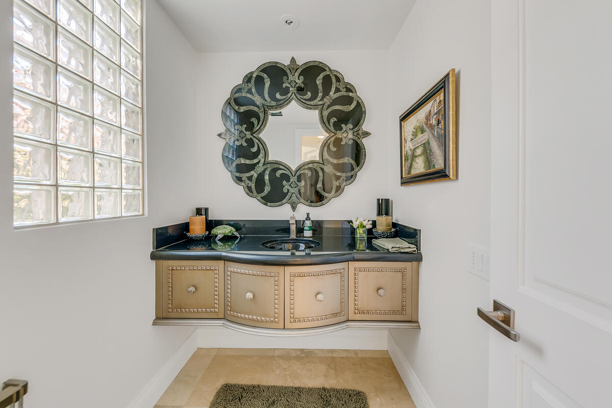 54310 Riviera La Quinta, CA 92253 - Photo 28 of 45 a room with a sink and a mirror