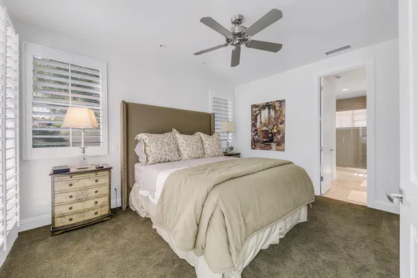 a bedroom with bed and a window