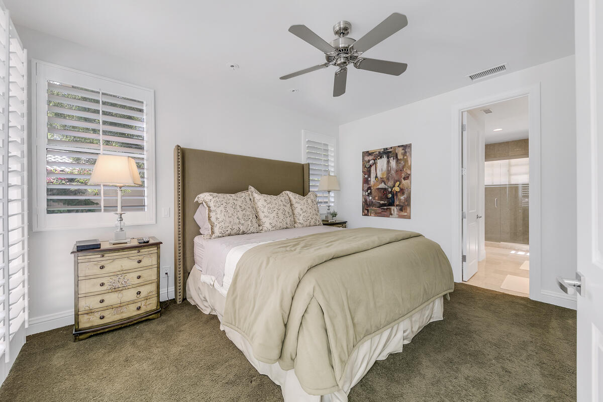 54310 Riviera La Quinta, CA 92253 - Photo 29 of 45 a bedroom with a bed and a window