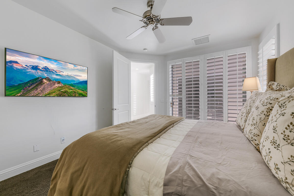 54310 Riviera La Quinta, CA 92253 - Photo 30 of 45 a bedroom with bed and a window