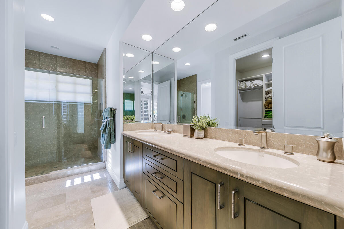 54310 Riviera La Quinta, CA 92253 - Photo 31 of 45 a bathroom with a double vanity sink mirror and shower