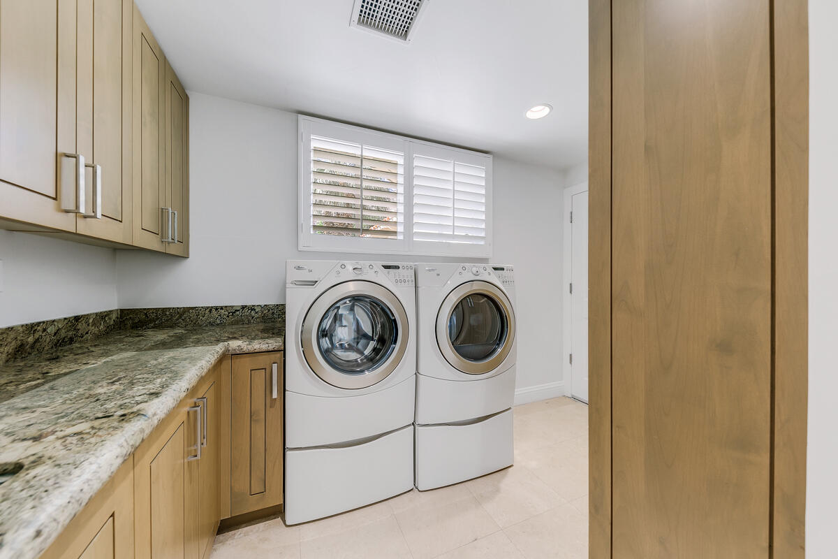 54310 Riviera La Quinta, CA 92253 - Photo 36 of 45 a utility room with dryer and washer