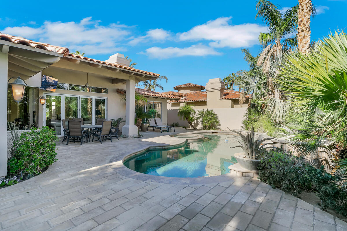 54310 Riviera La Quinta, CA 92253 - Photo 40 of 45 a swimming pool with outdoor seating and yard