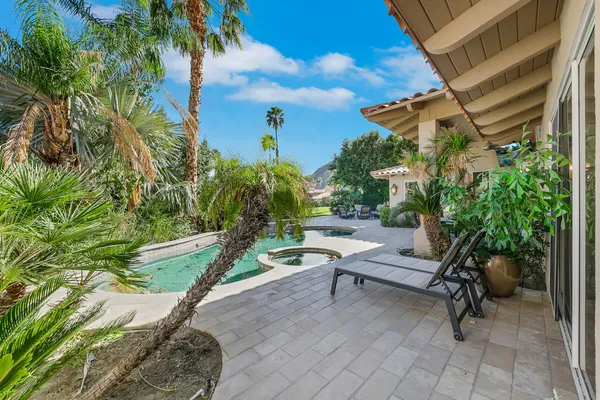 a view of a swimming pool with a patio
