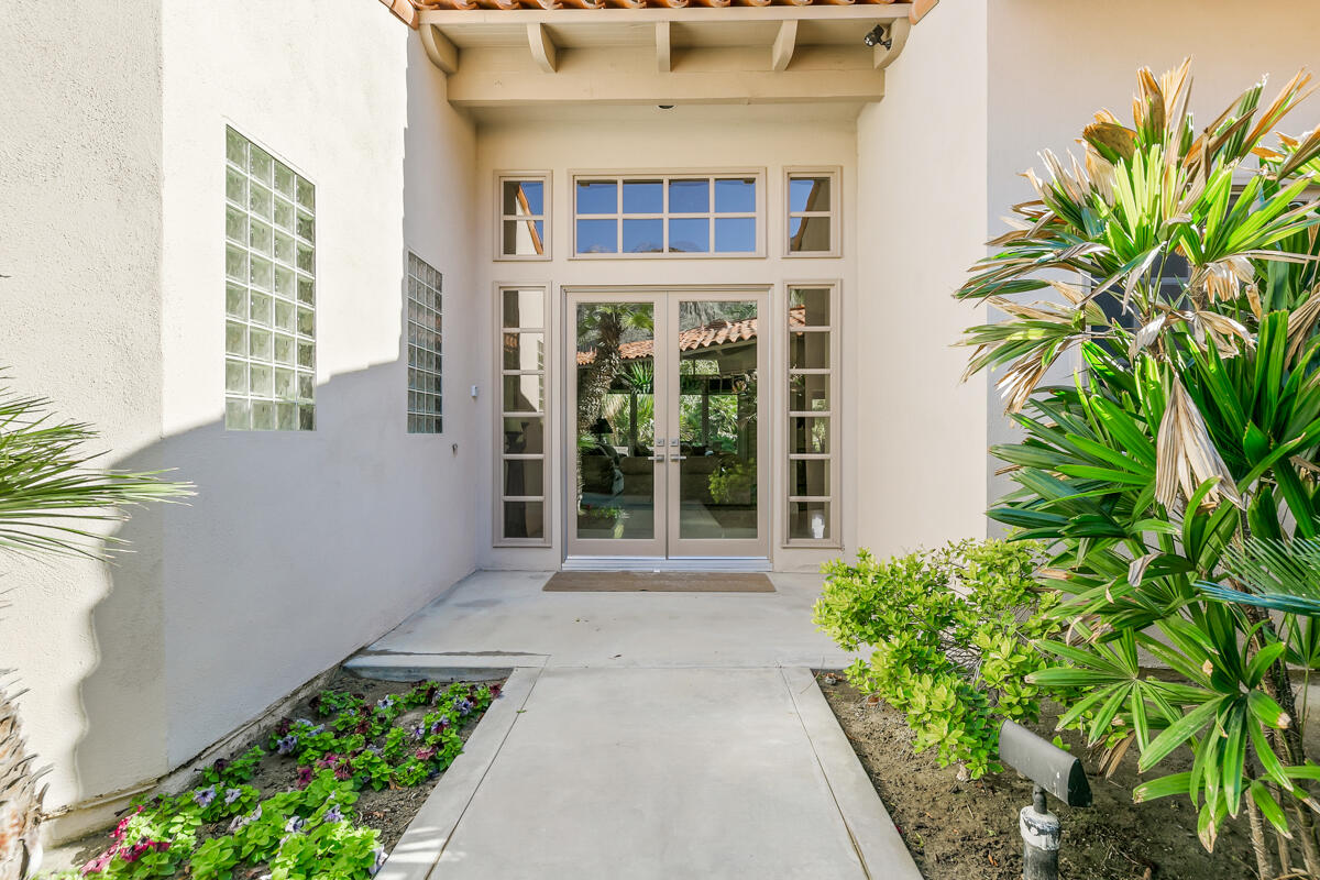54310 Riviera La Quinta, CA 92253 - Photo 5 of 45 a front view of a house with a yard