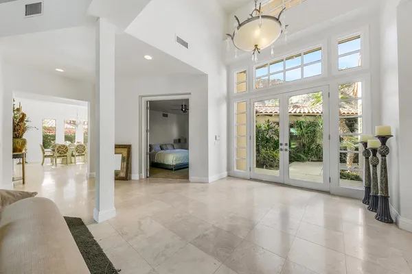 a view of a livingroom with a floor to ceiling window and a living room