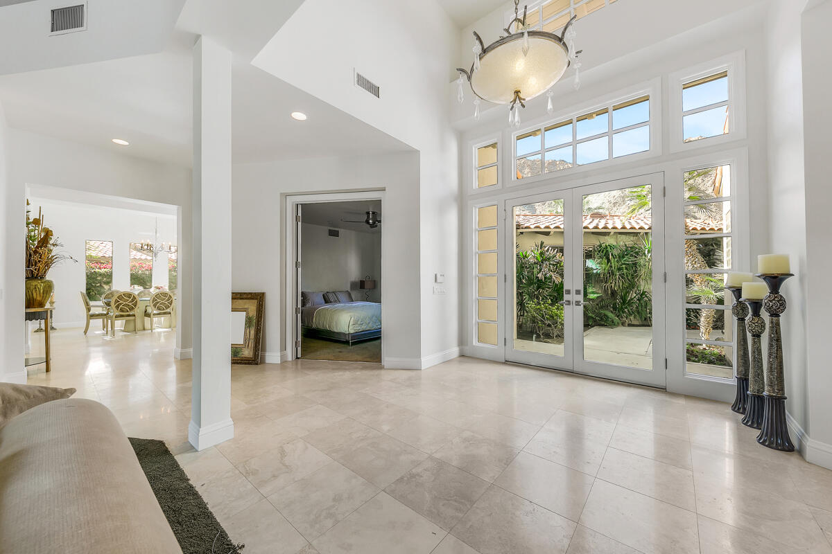 54310 Riviera La Quinta, CA 92253 - Photo 6 of 45 a view of a livingroom with a floor to ceiling window and a living room