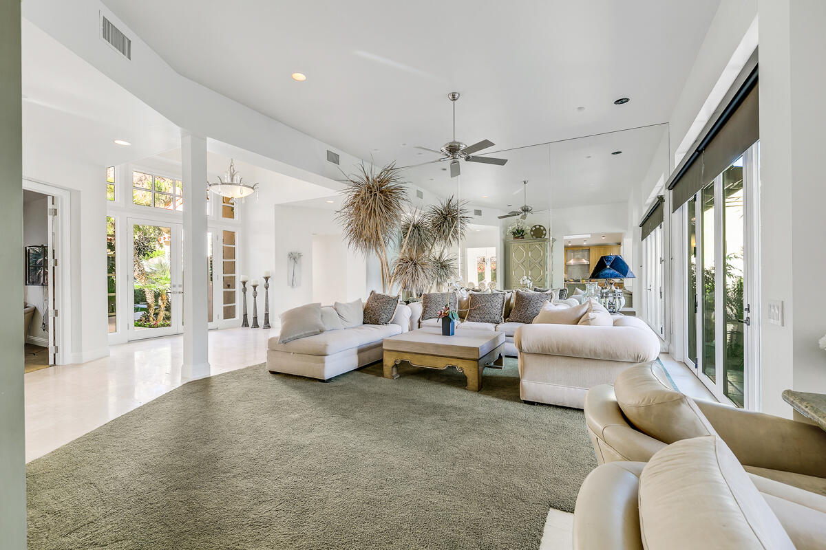 54310 Riviera La Quinta, CA 92253 - Photo 9 of 45 a living room with furniture and a large window