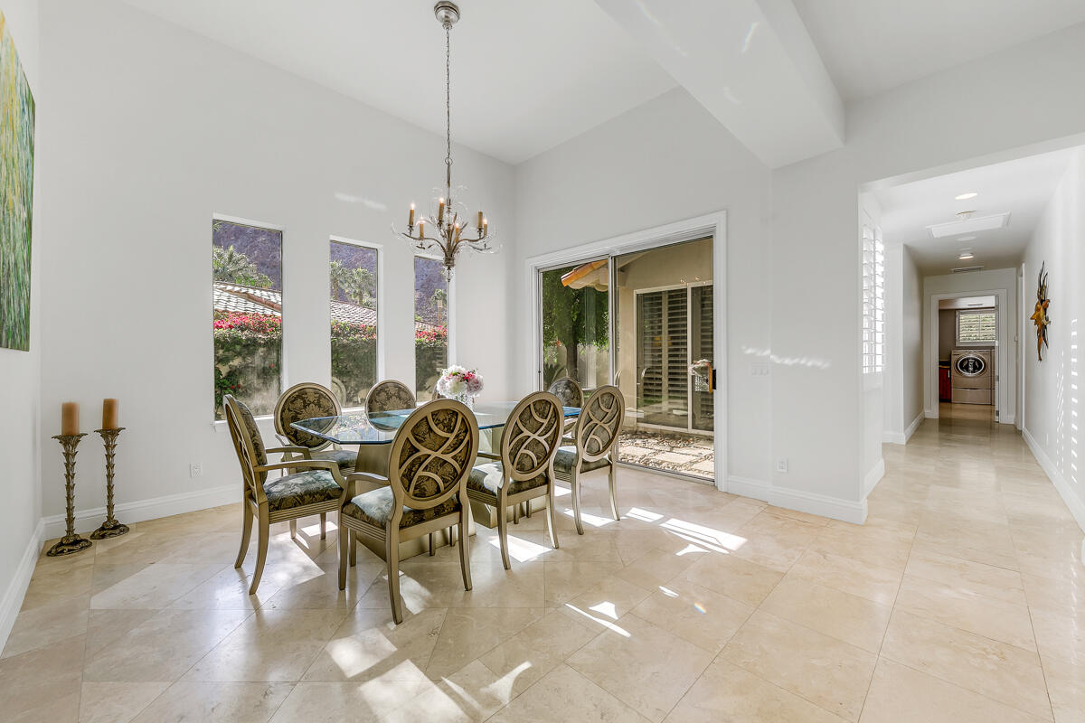 54310 Riviera La Quinta, CA 92253 - Photo 10 of 45 a view of a dining room with furniture and chandelier