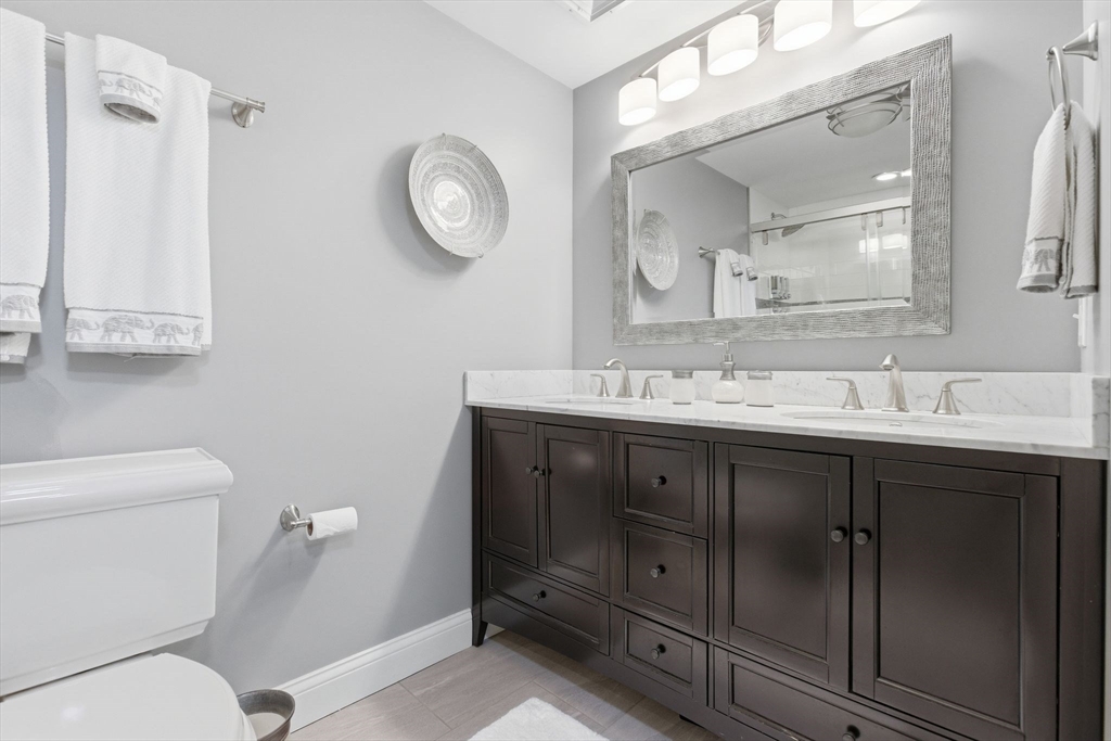 419 Main Street Boston, MA 02129 - Photo 33 of 41 a bathroom with a sink vanity and a mirror