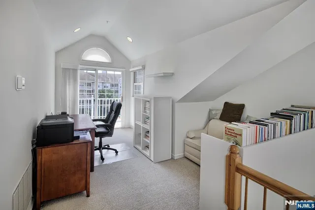 a workspace with furniture and a window