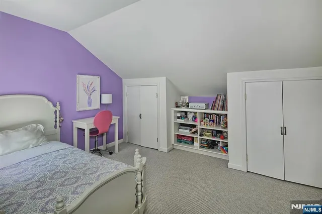 a bedroom with a bed and closet