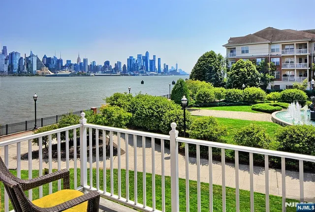 a view of a house with a yard and deck