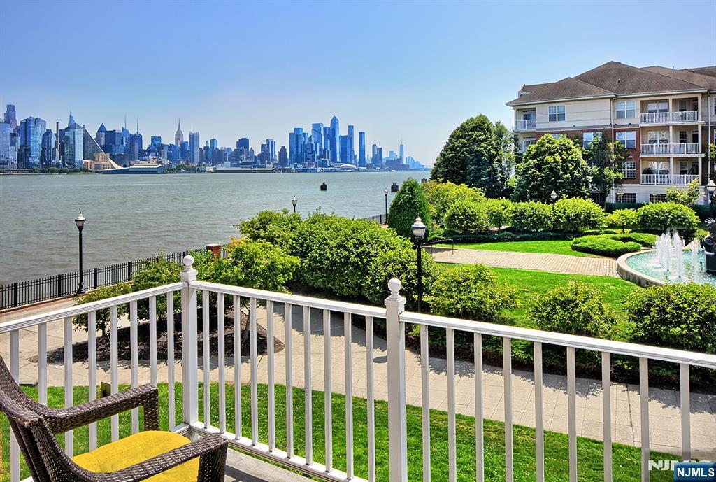406 Newburgh Court West New York, NJ 07093 - Photo 2 of 31 a view of a house with a yard and deck