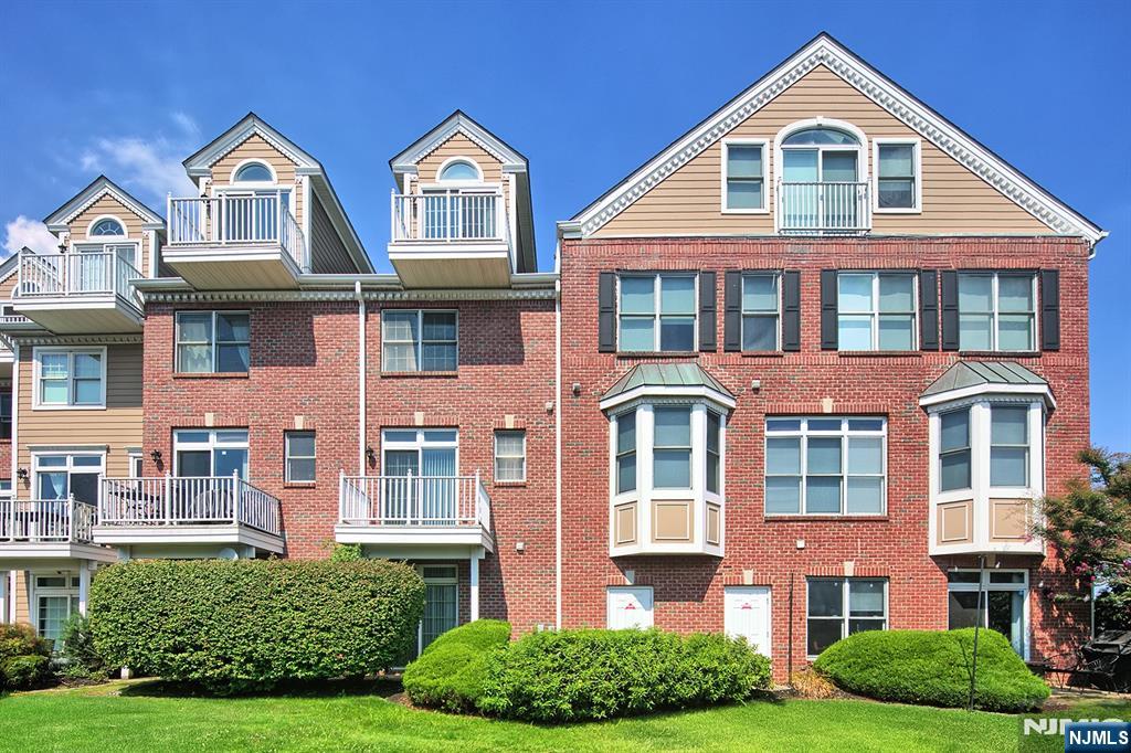 406 Newburgh Court West New York, NJ 07093 - Photo 22 of 31 a front view of residential houses with yard and green space