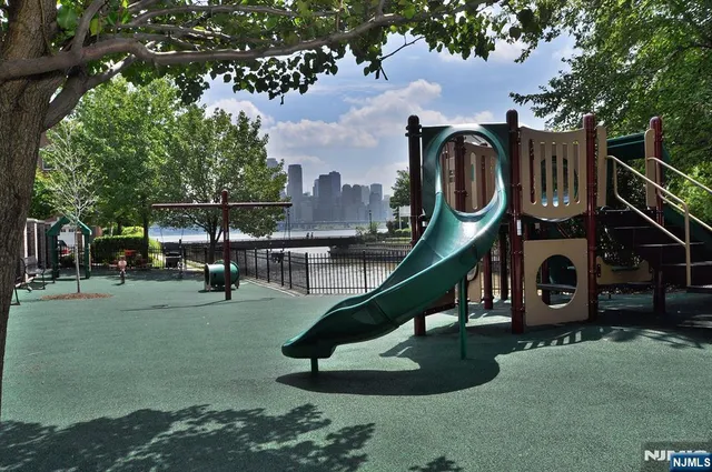 a childrens park with lots of swings and slides