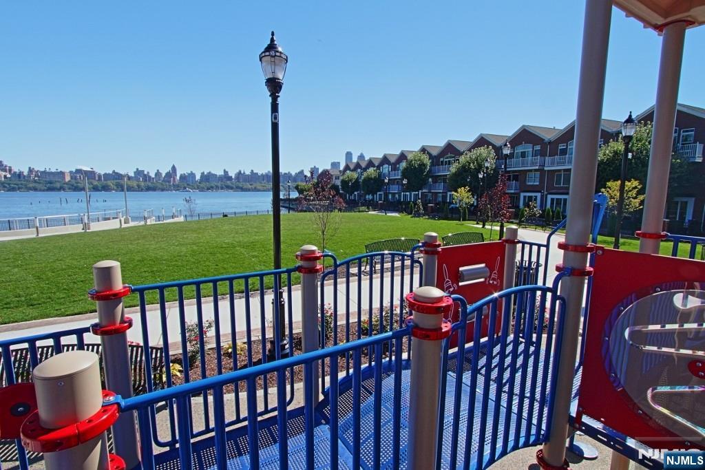 406 Newburgh Court West New York, NJ 07093 - Photo 27 of 31 a view of a two chairs and table in the deck